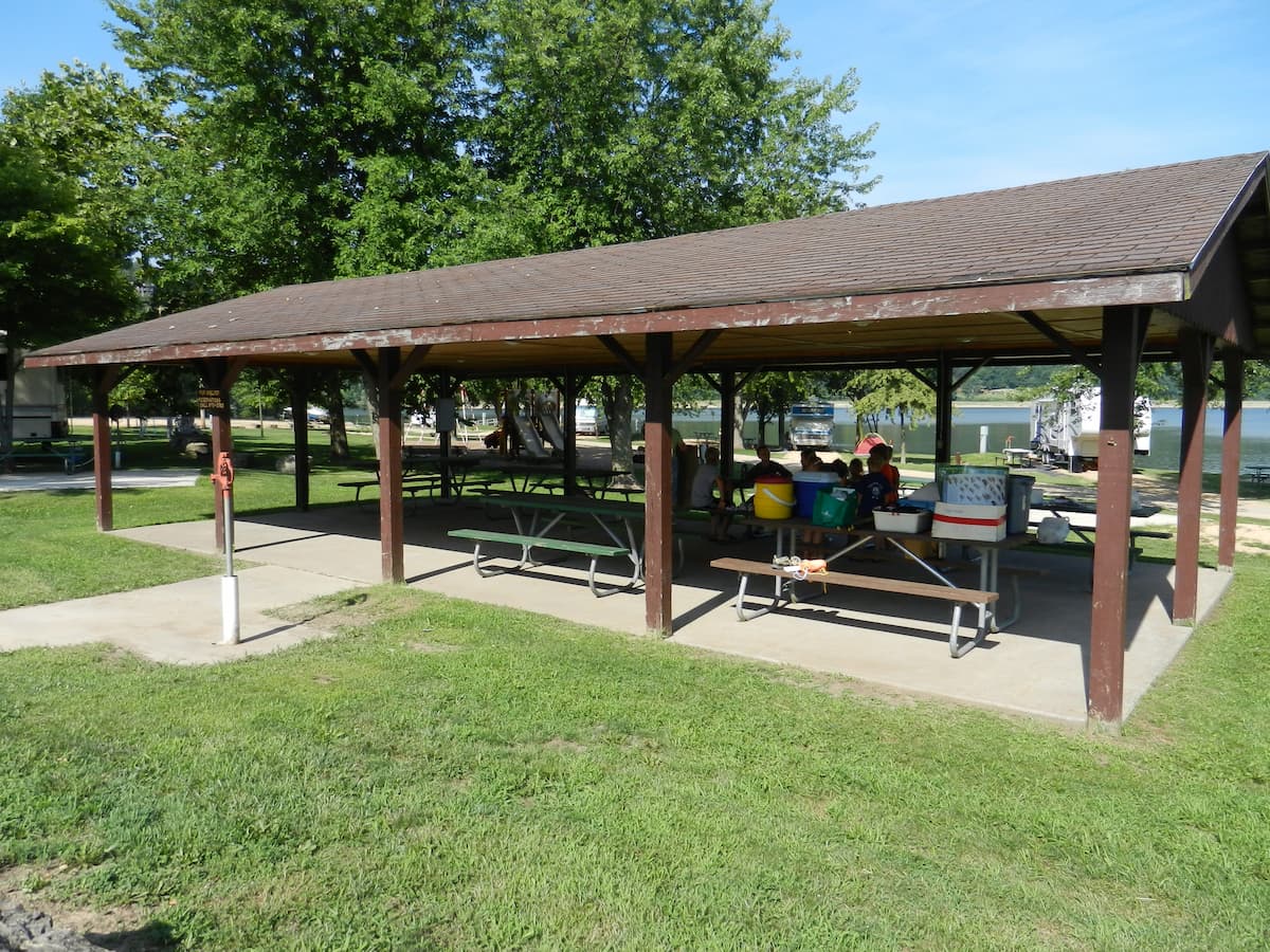 A pavilion available at the park with picnic tables and open sides. 