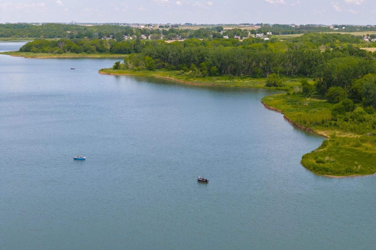 Boaters on Robert's Creek Park lake in the summertime