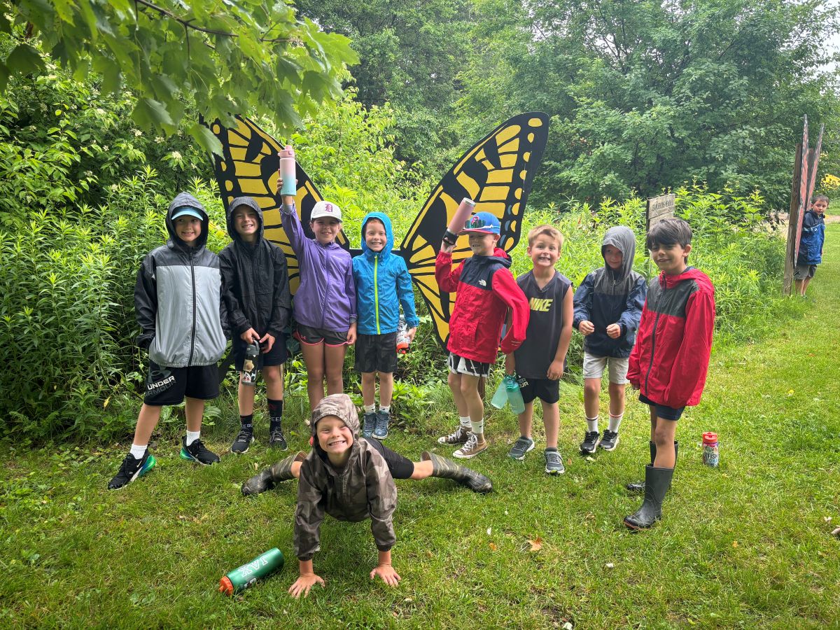 Students pose at the the butterfly garden