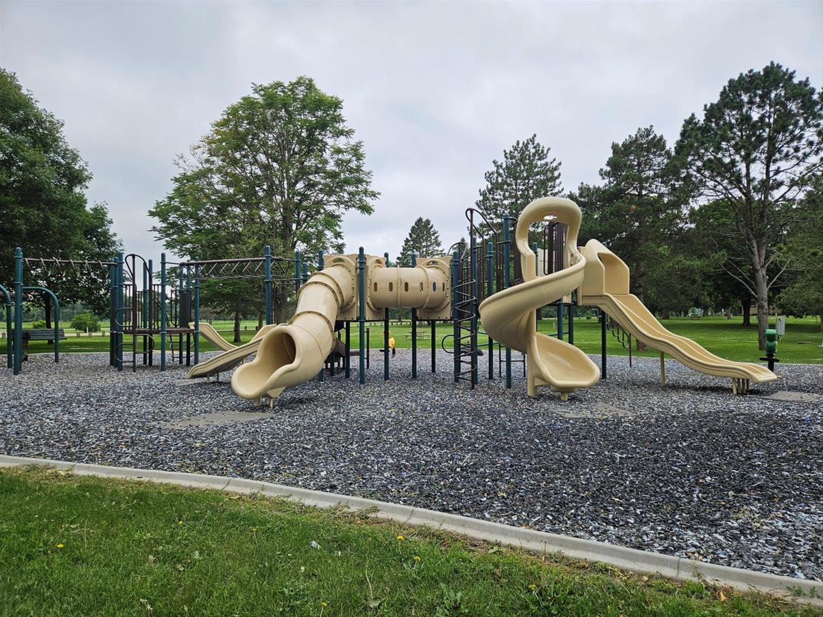 Playground area with slides and climbing activities near cabins and campgrounds.