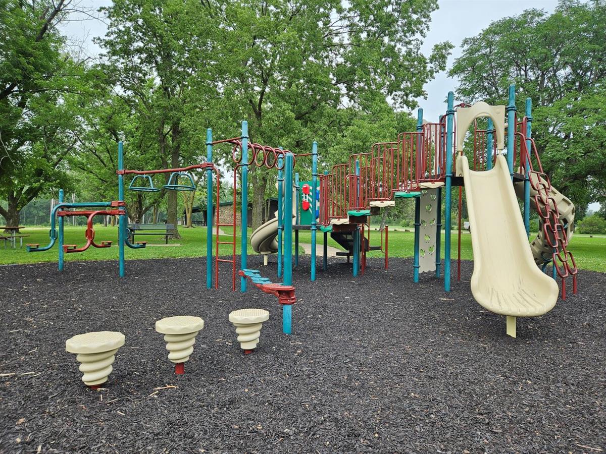 Playground area with slides and climbing activities near Heritage Shelter.