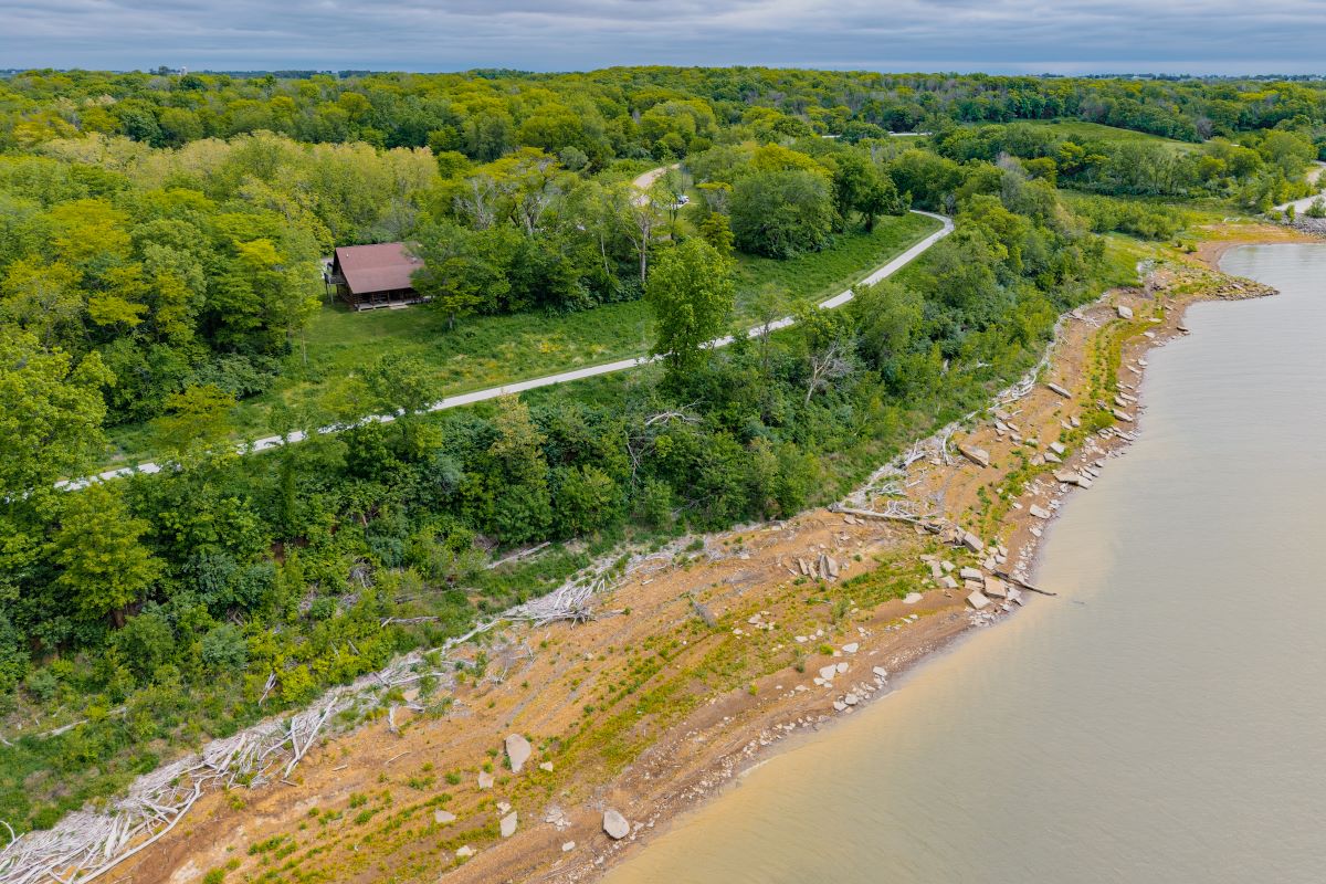 Aerial view of cabin location, cabins on bluff overlooking lake in wooded area with grass yards