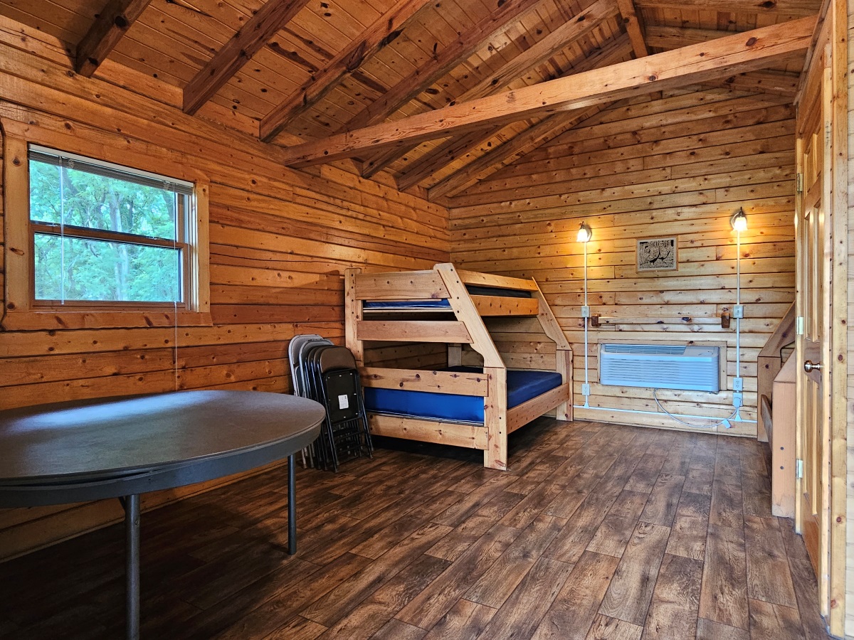 Prairie Rose - Cabin interior showing folding table & chairs and bunkbeds