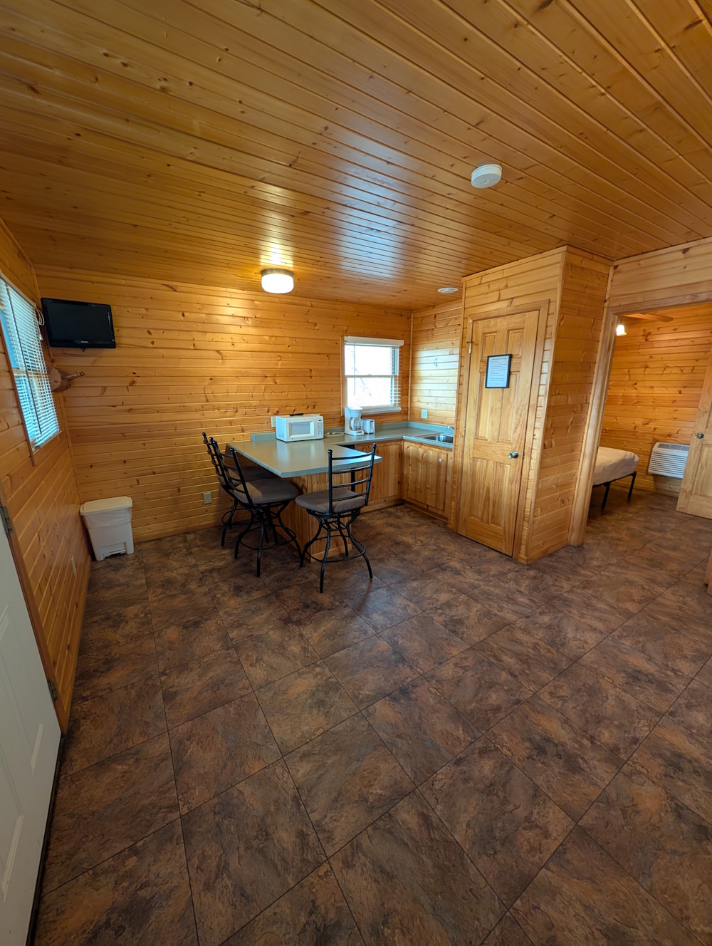 Bluegill Bungalow- kitchenette space and bar counter seating in cabin.