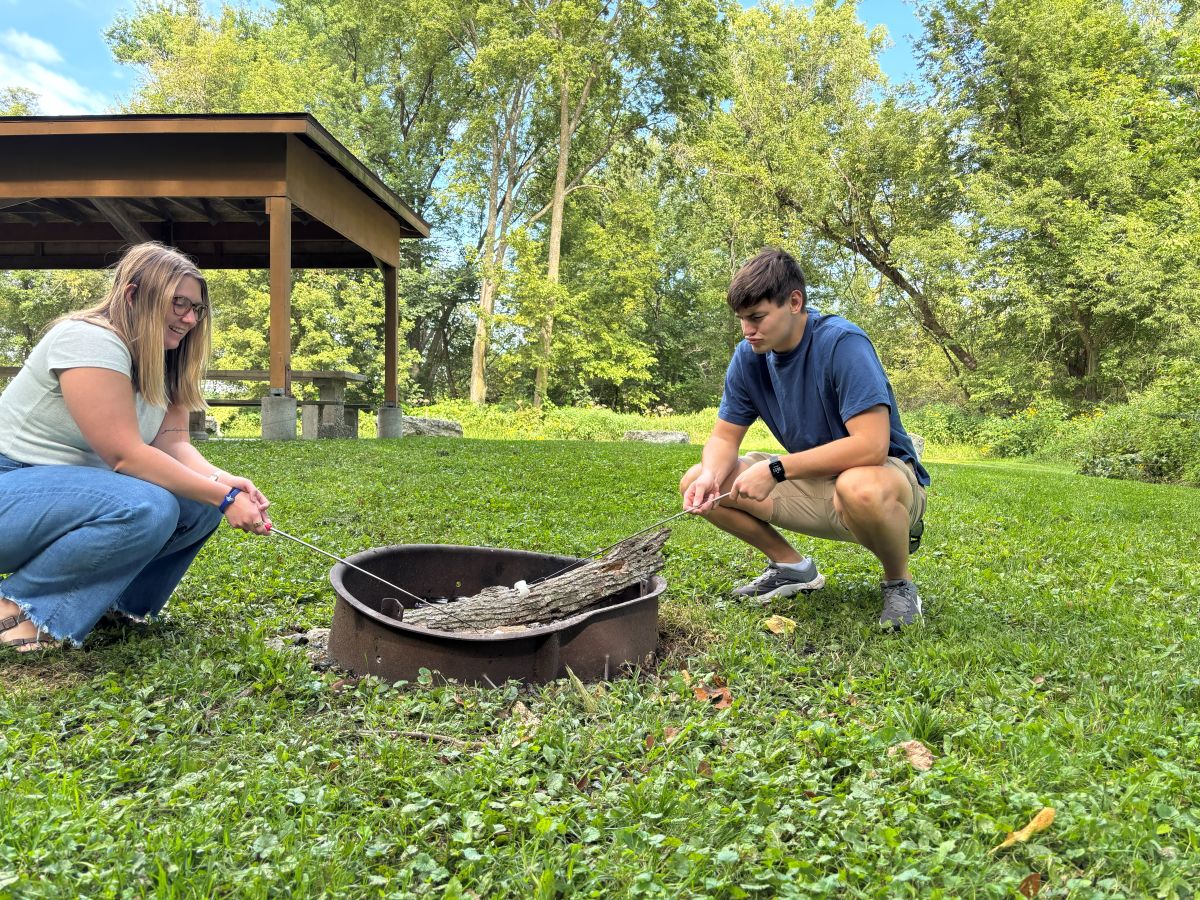 Making s'mores over the fire at Chattahoochie Park