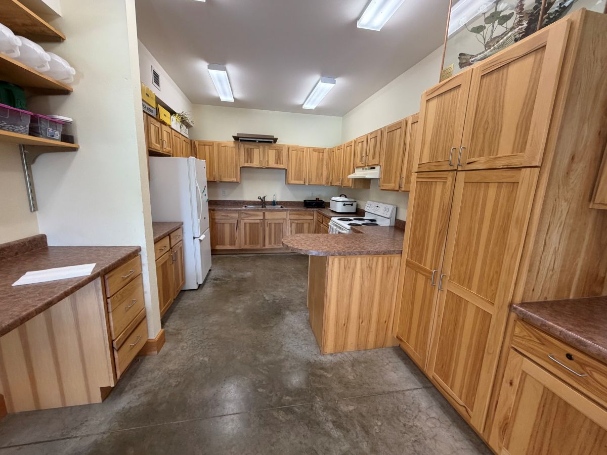 Lake Iowa Nature Center - full kitchen in lower level of nature center with refrigerator, sink, stov
