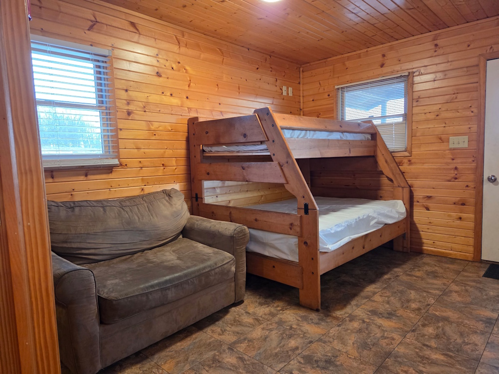 Bluegill Bungalow- main living space with bunkbed and chair