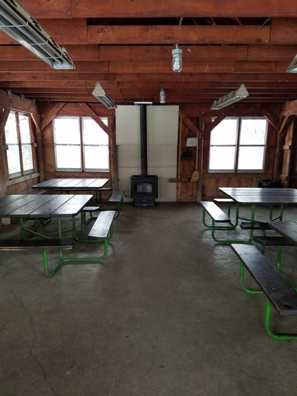 Interior of Big Sioux Shelter 1 : inside view of shelter with small fire place, picnic table